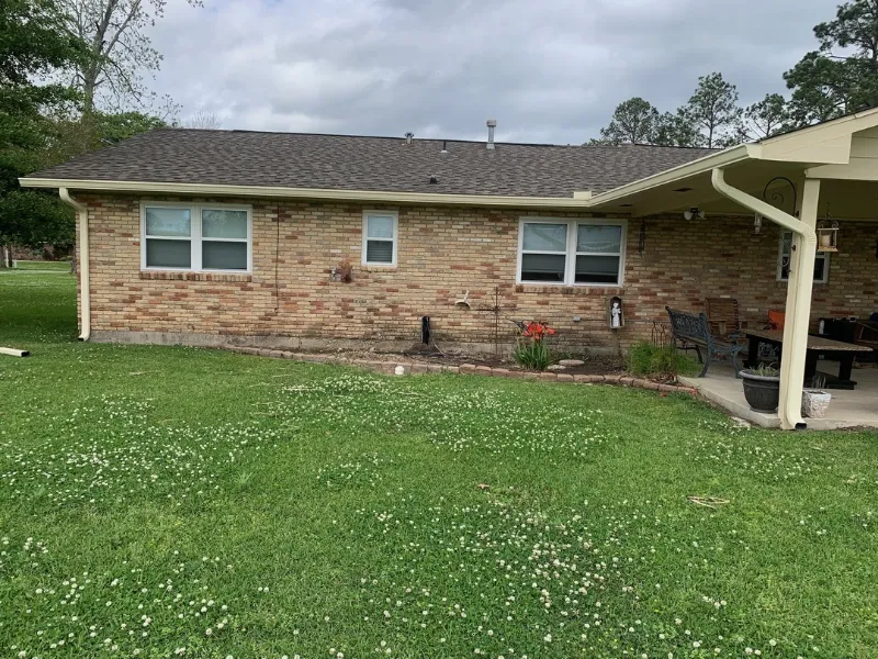 backyard view home gutters side yard prairieville performance patios and gutters