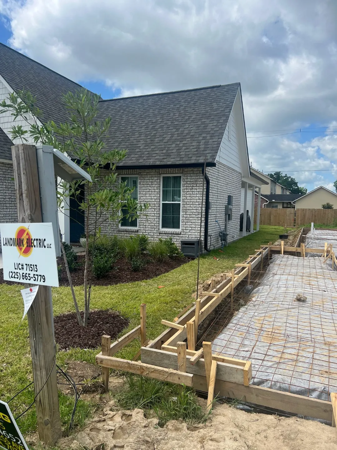 black gutters light brick house construction livingston la