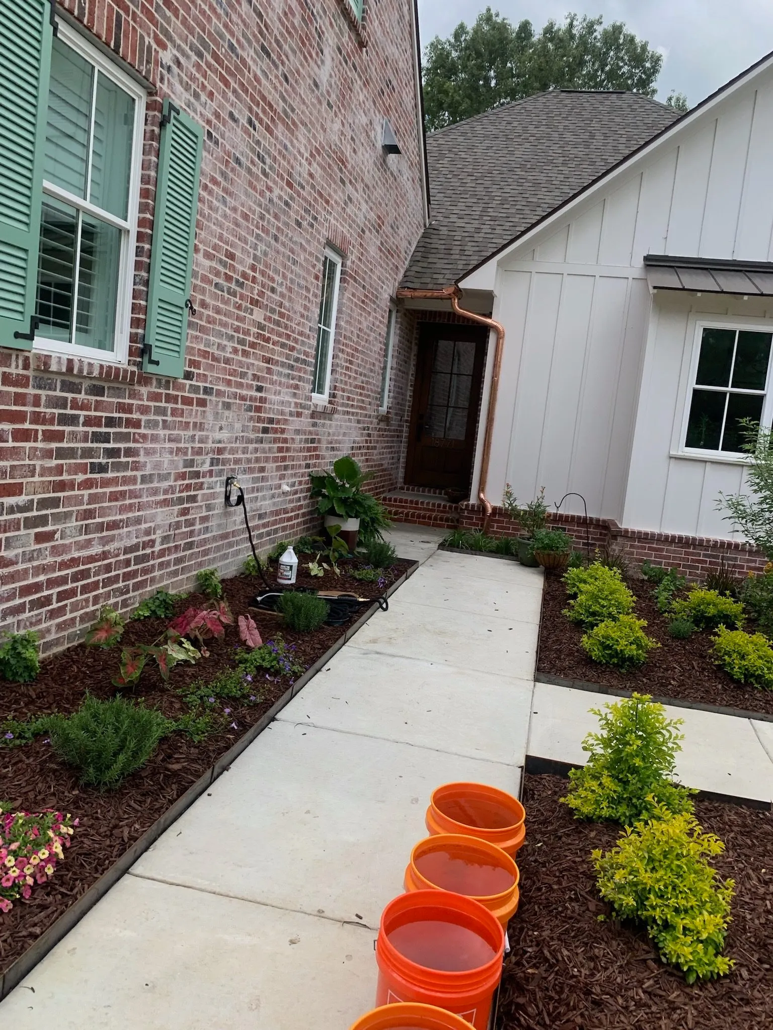 brick house copper gutters green shutters prairieville la