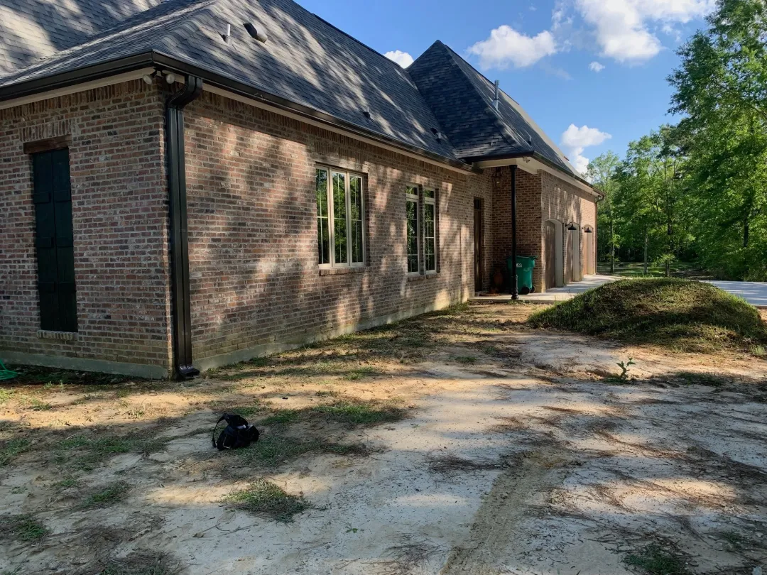 brick house dark gutters dirt yard prairieville la