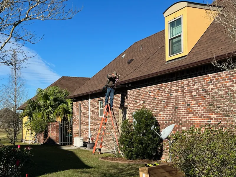 brown gutter installation on brick house prairieville