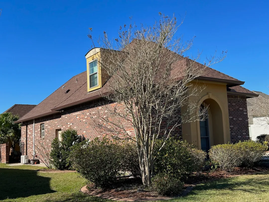 brown gutters on red brick house baton rouge