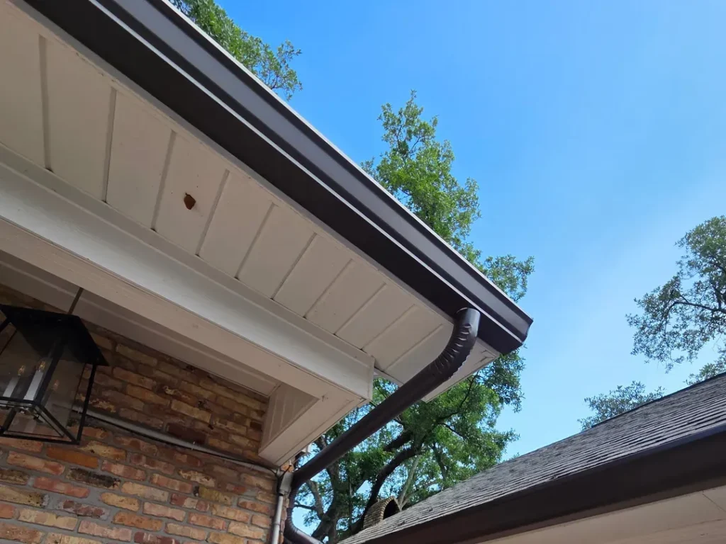 brown seamless gutters installation closeup performance patios and gutters baton rouge