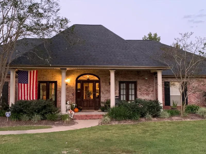 classic red brick home american flag display baton rouge