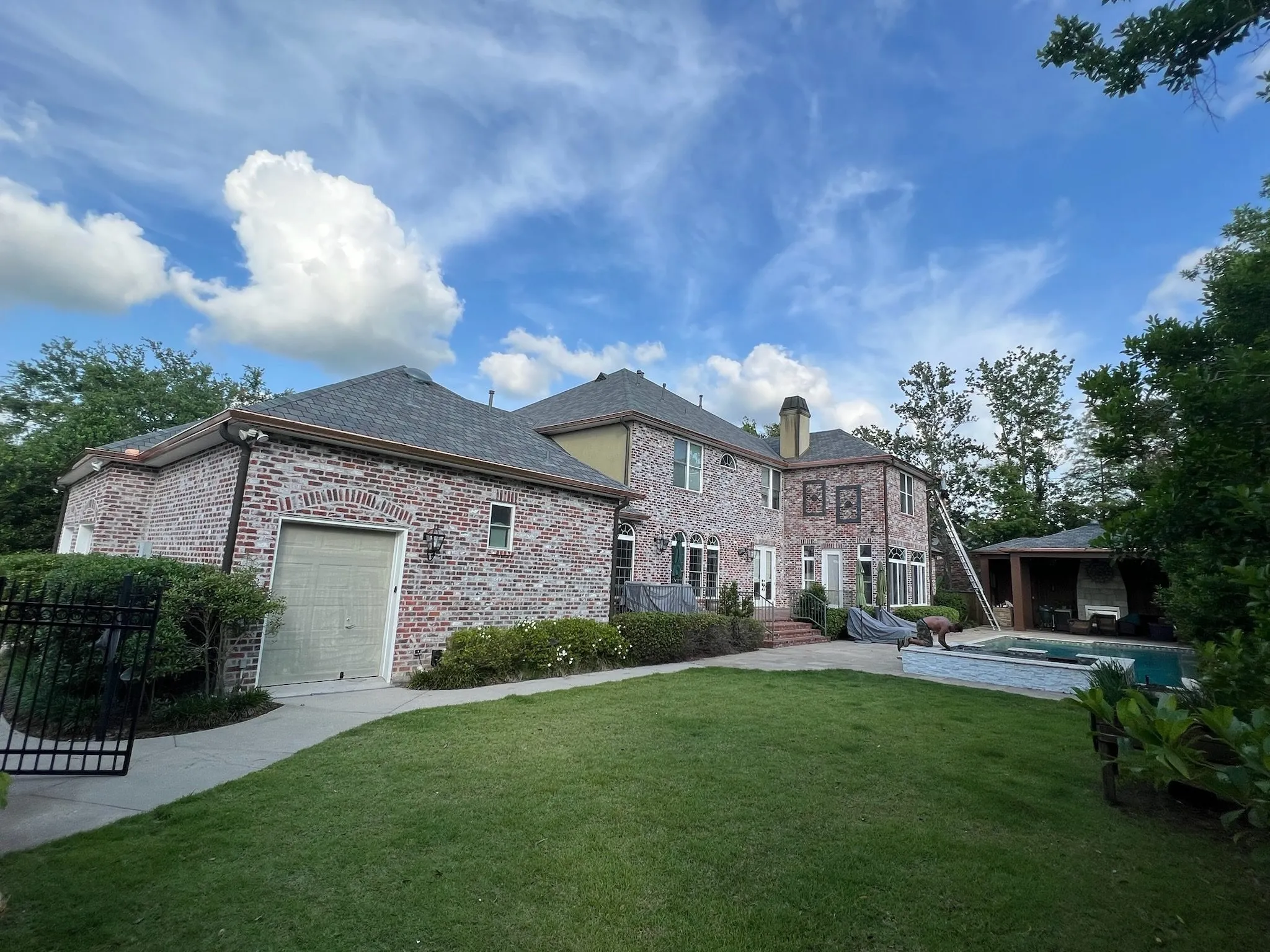 copper gutters brick home back performance patios