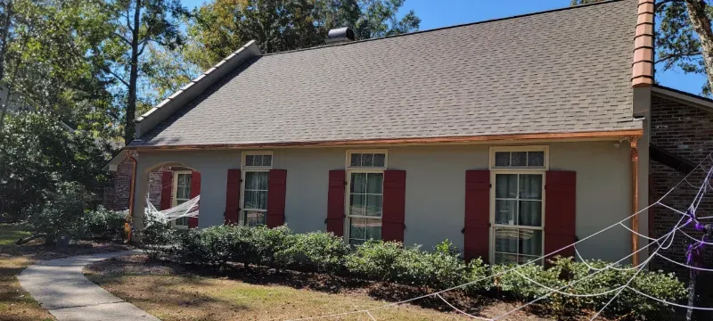 copper gutters light stucco house halloween baker