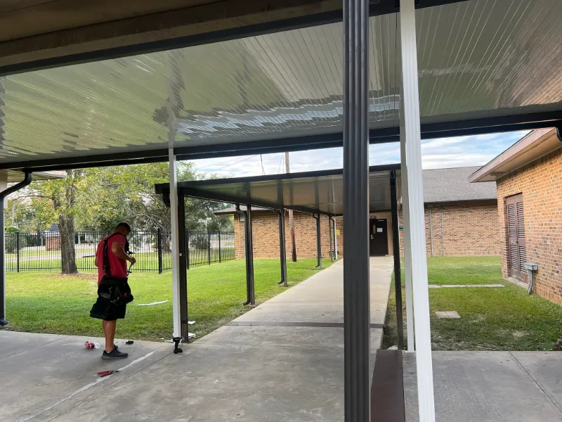 covered walkway install brick building gonzales la