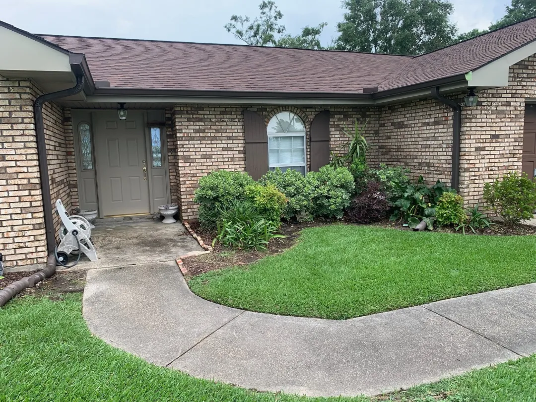dark brown gutters brick home front performance patios laplace la