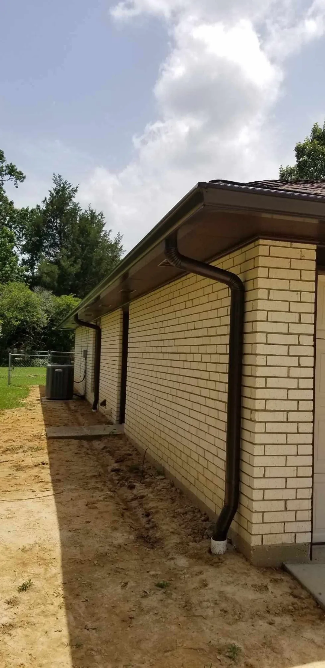 dark brown gutters brick house denham springs performance