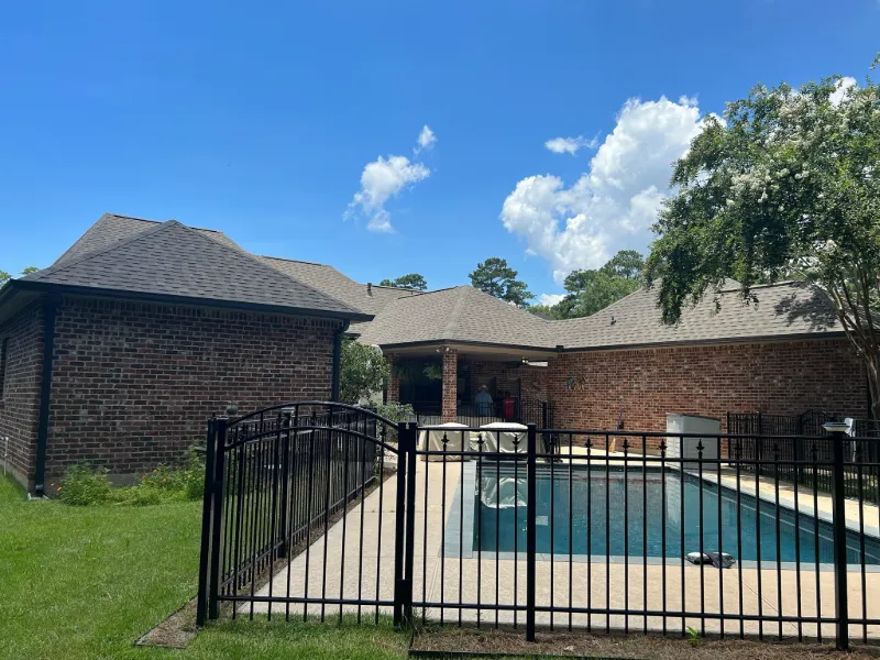 dark brown gutters brick house pool backyard view prairieville la