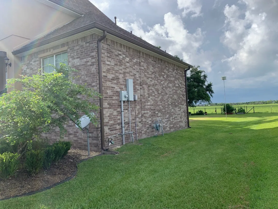 dark brown gutters brick house side performance patios la