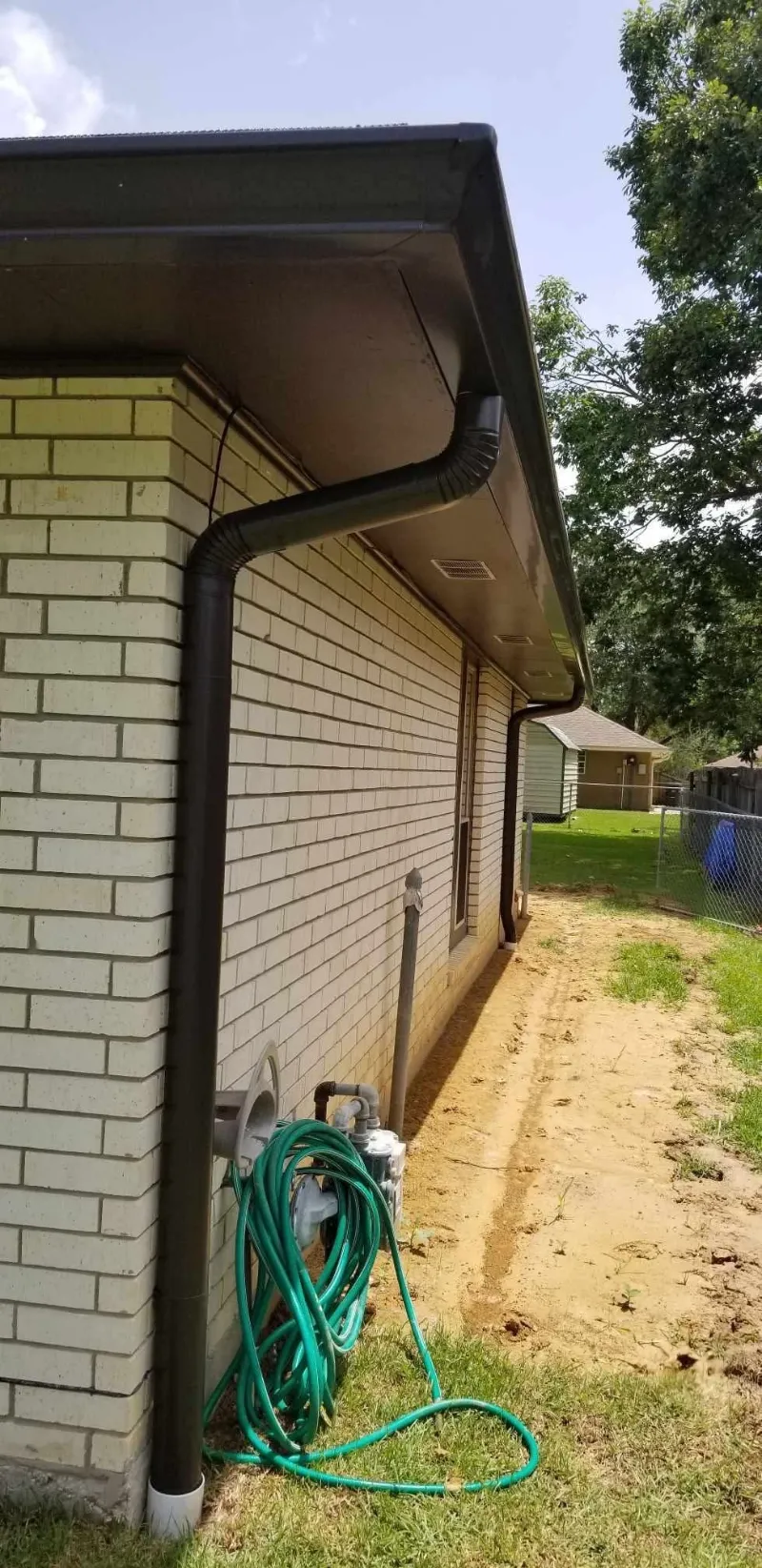 dark brown gutters brick house walker la performance