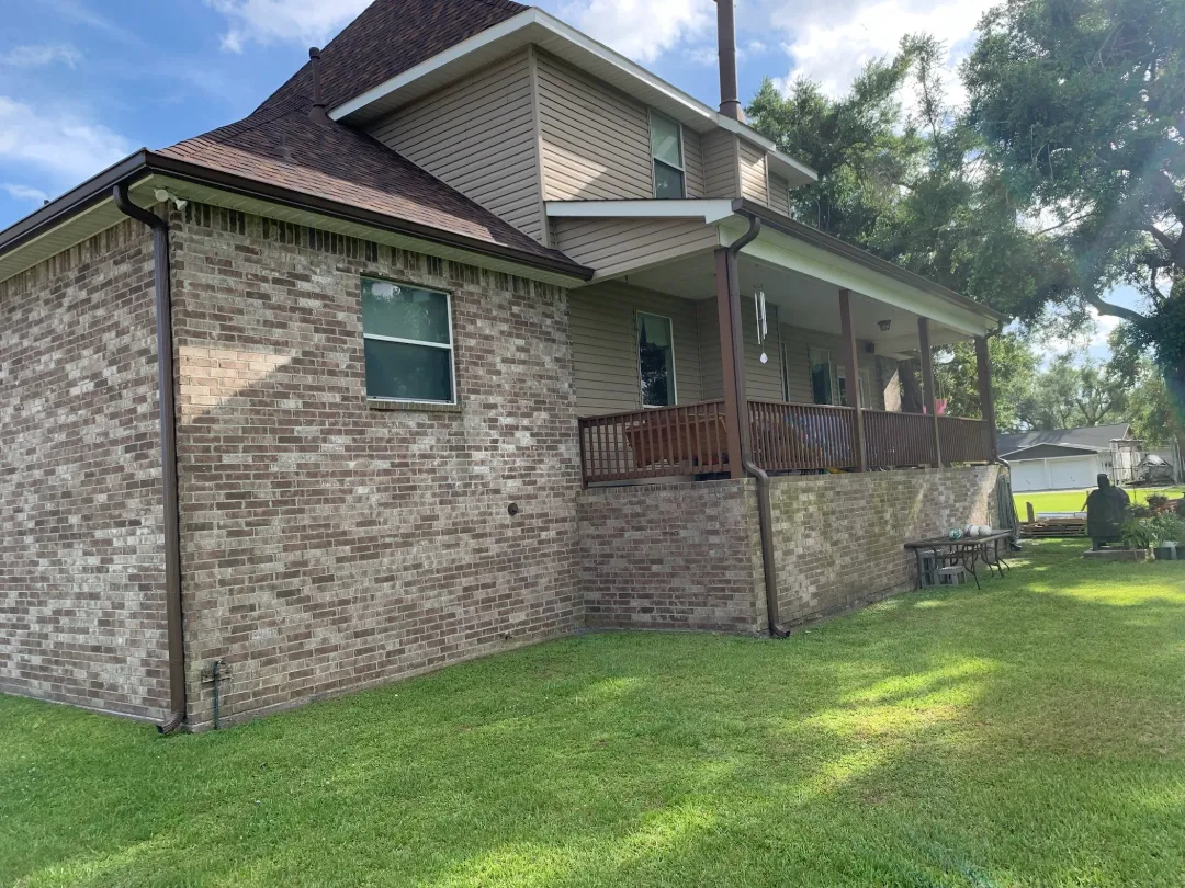 dark brown gutters brick siding house performance patios