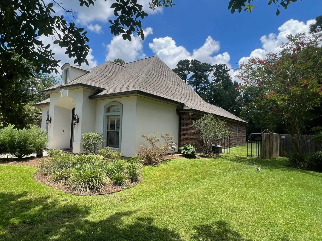 dark brown gutters stucco brick house shenandoah la
