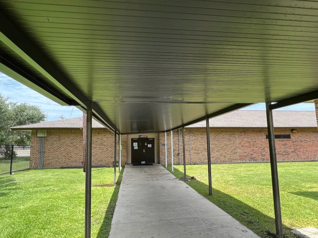 dark covered walkway integrated gutters gonzales la