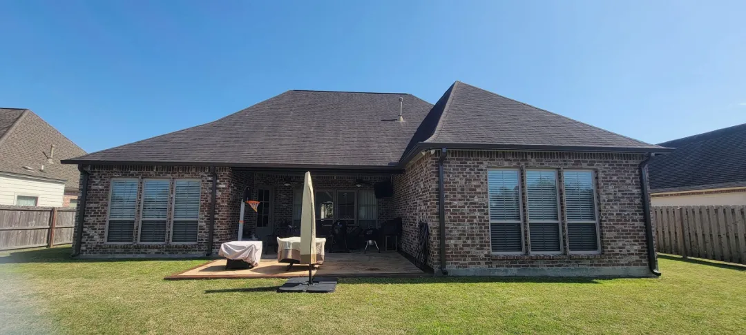 dark gutters back of brick house lake charles scaled