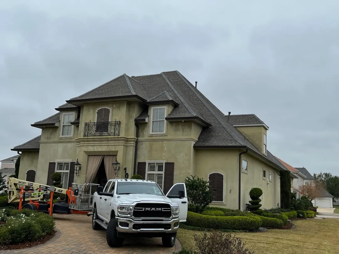 dark gutters large stucco house baton rouge area