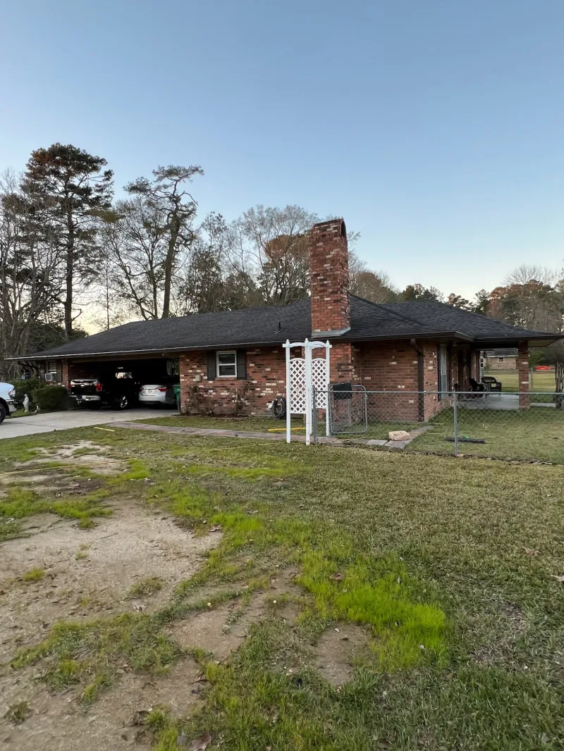 dark gutters on long brick house central
