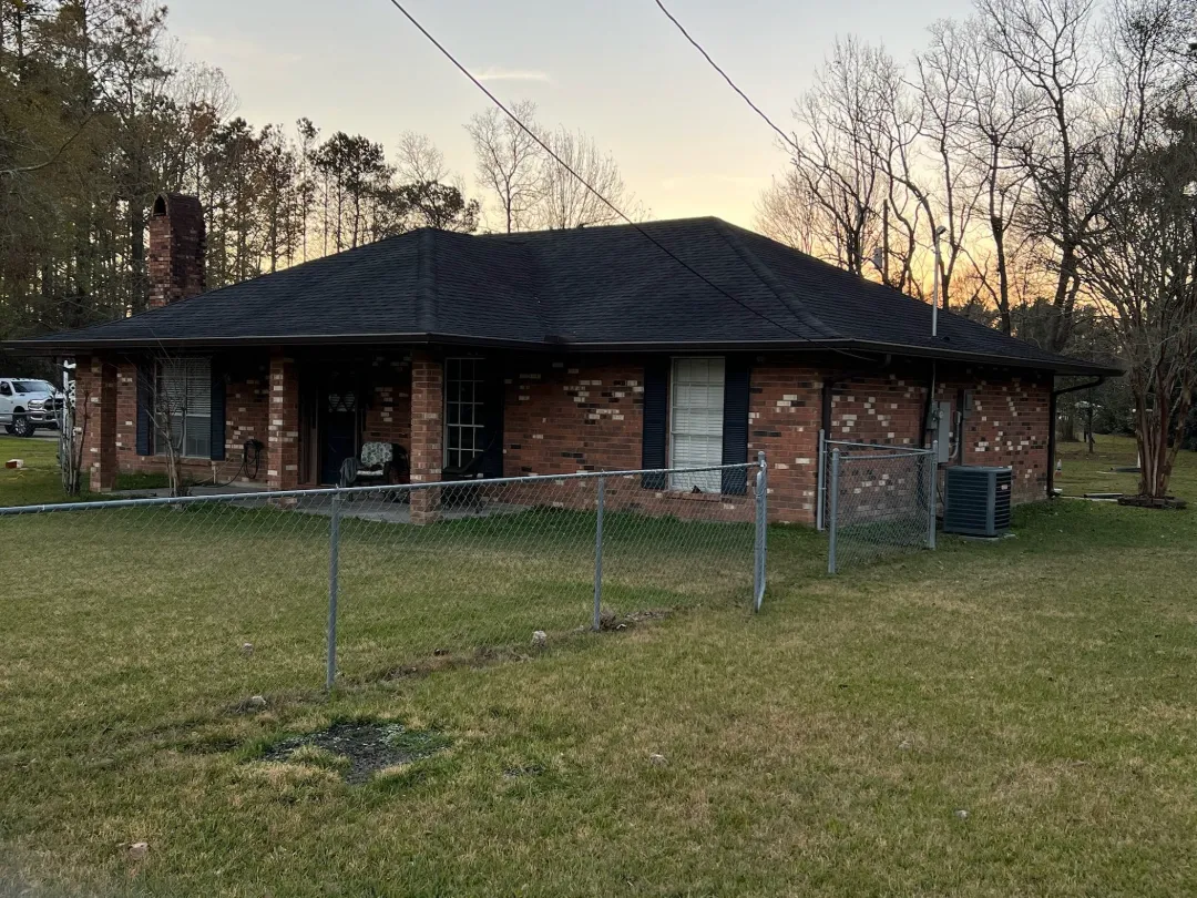 dark gutters on red brick house new orleans