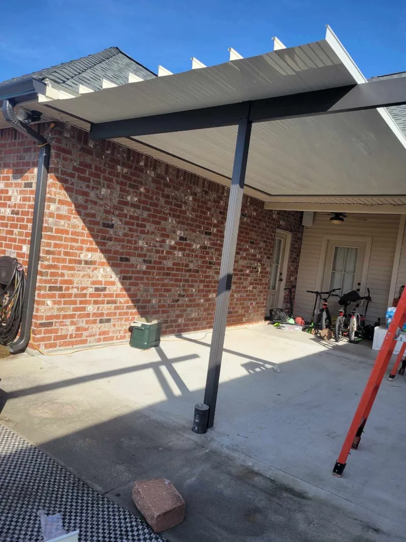 downspout and gutter installation on brown brick home in baton rouge