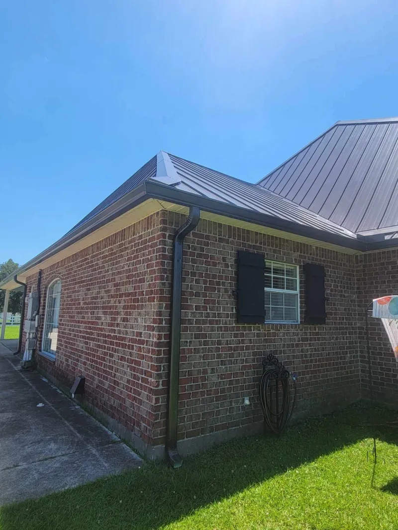 downspout installation on white house in denham springs