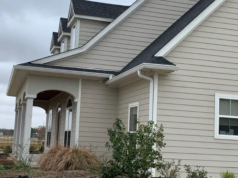 front yard and gutters on brick home