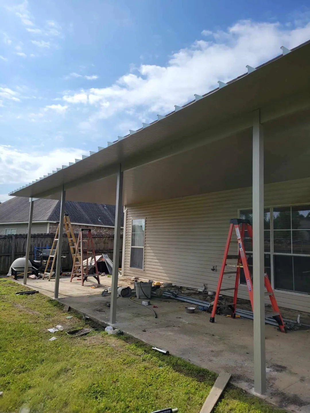 gutter and downspout installation on brown house in prairieville