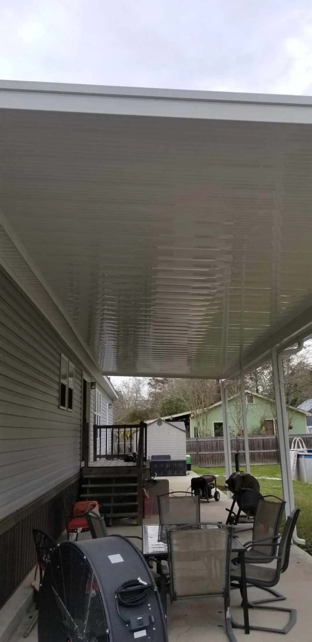 gutter fascia installation on brown shingle roof in denham springs
