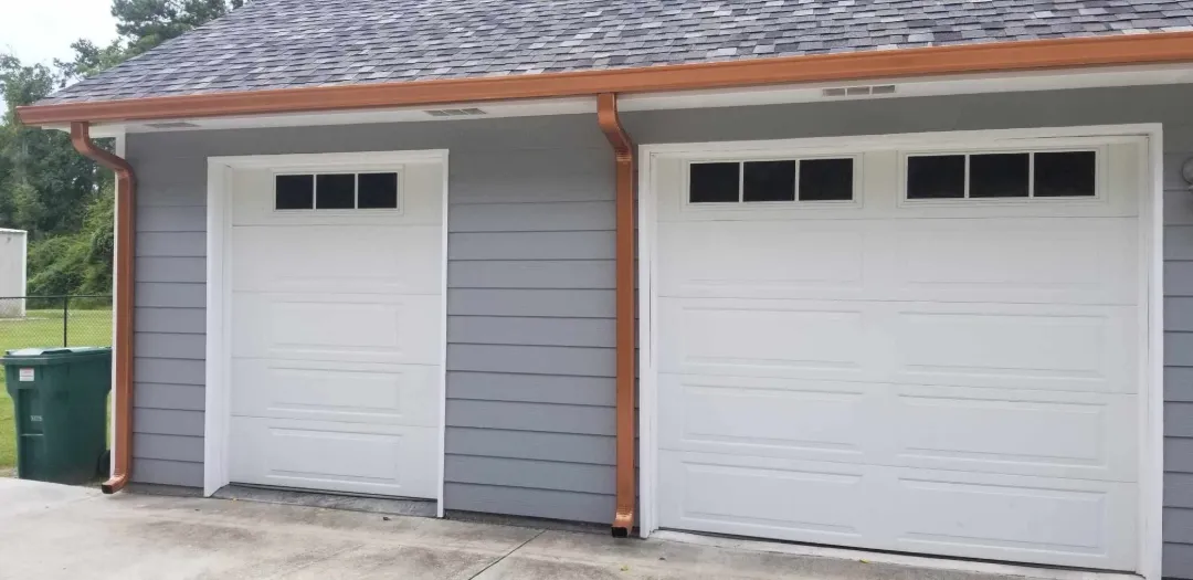 gutter installation around patio with fencing in prairieville