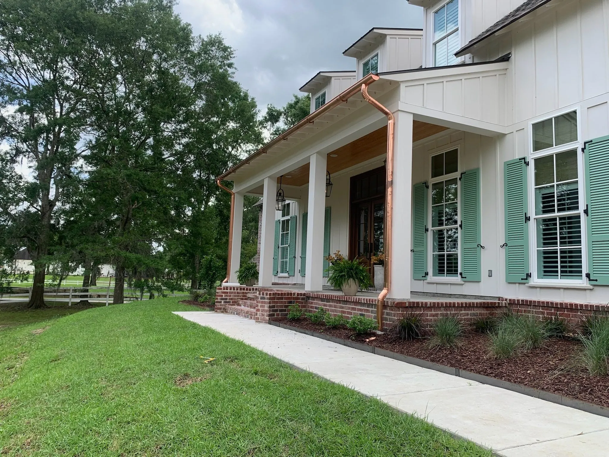 light colored house copper gutters prairieville la
