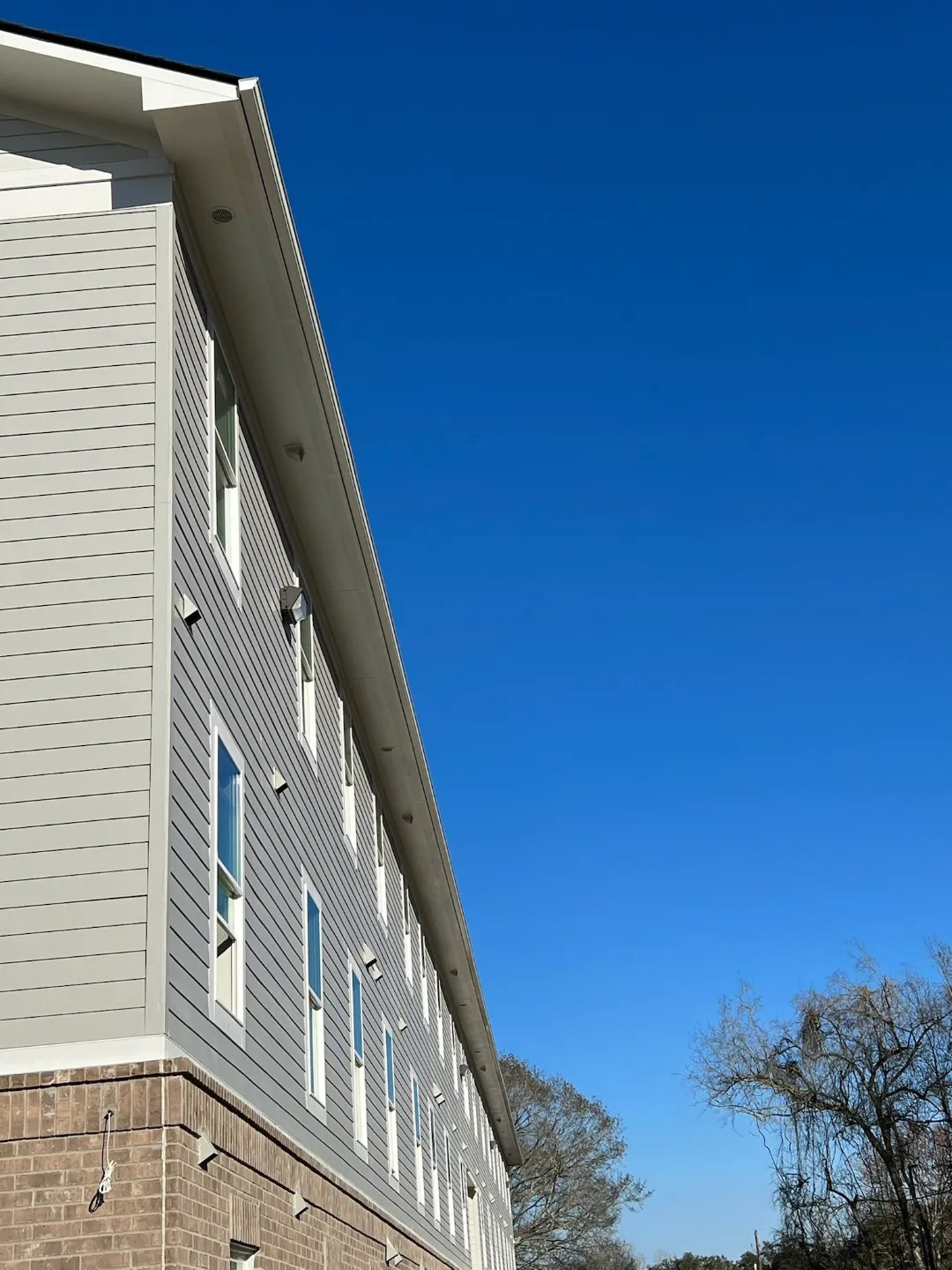 light gutters on multi story building baton rouge
