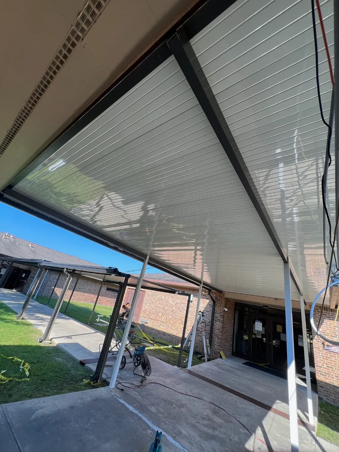 metal covered walkway brick building gonzales la