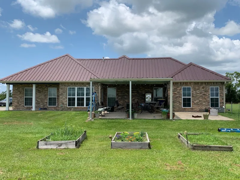 modern white stucco home gutters closeup
