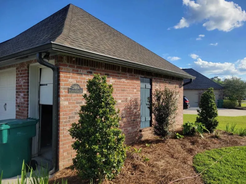 side view gutter installation on home in baton rouge