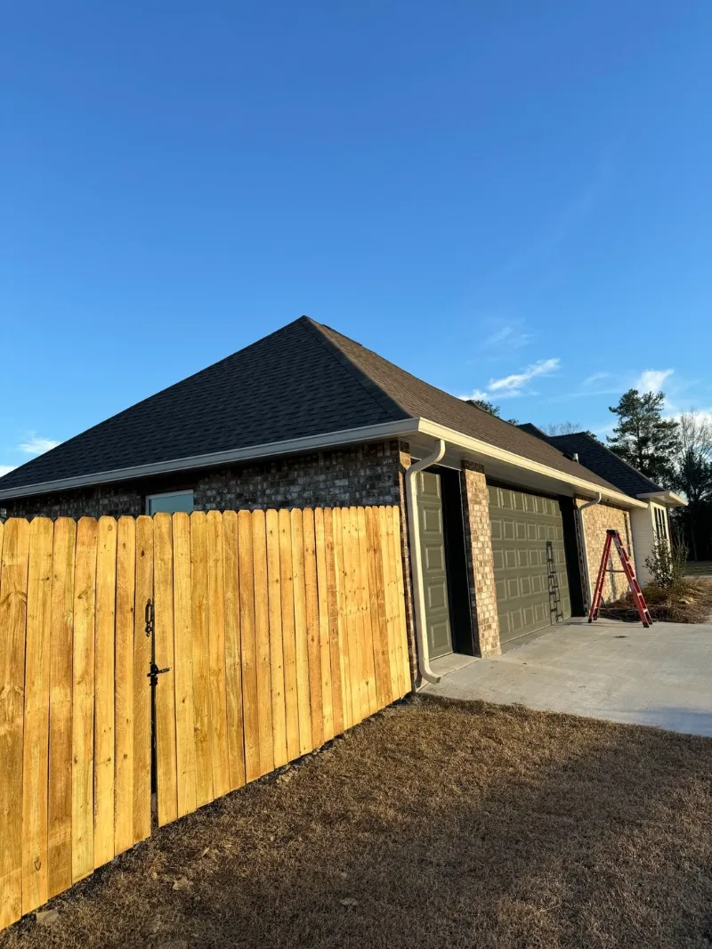 white brick home covered patio white gutters
