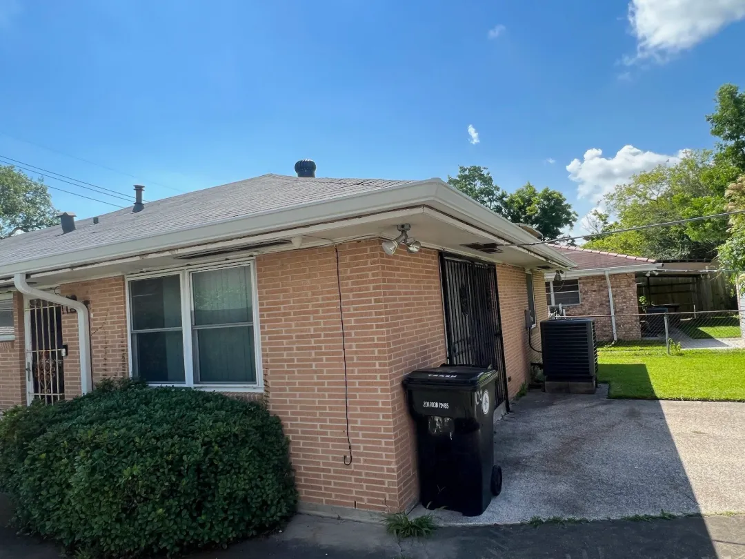 white gutters brick building central la performance patios