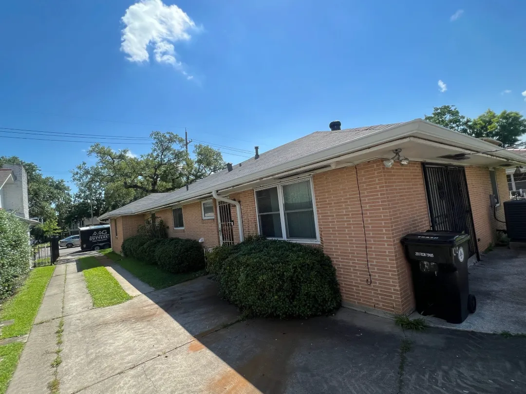 white gutters brick building port allen la performance patios