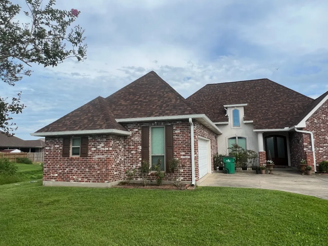 white gutters brick home front yard rayne la