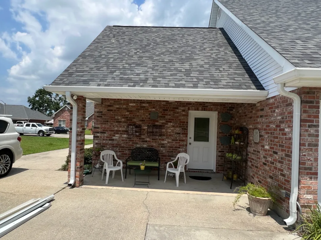 white gutters brick house covered porch walker la