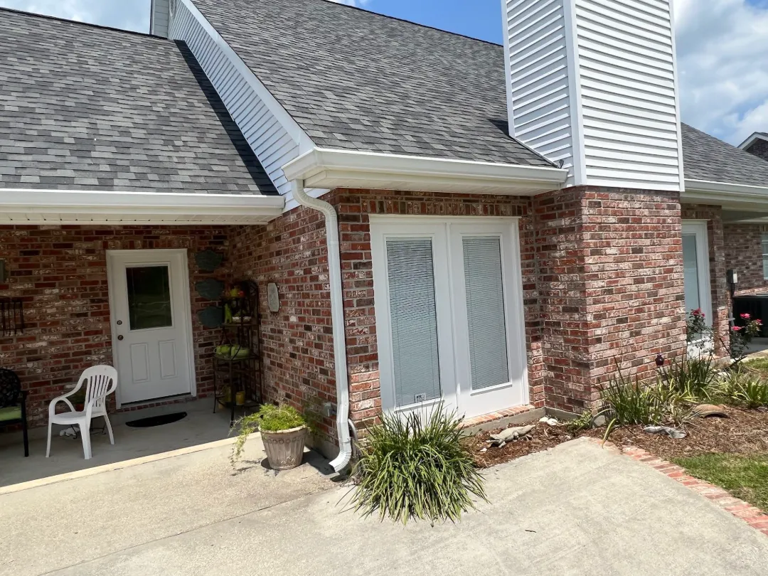 white gutters brick house patio central la performance