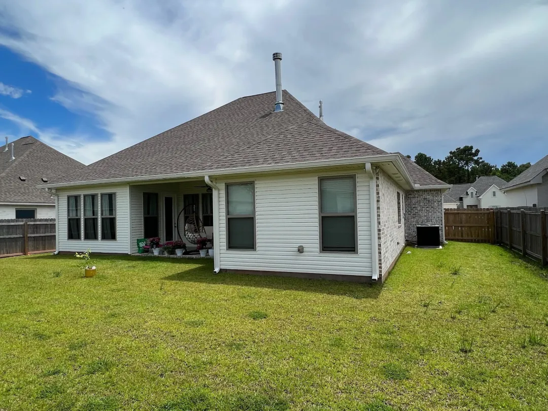 white gutters siding brick house thibodaux la
