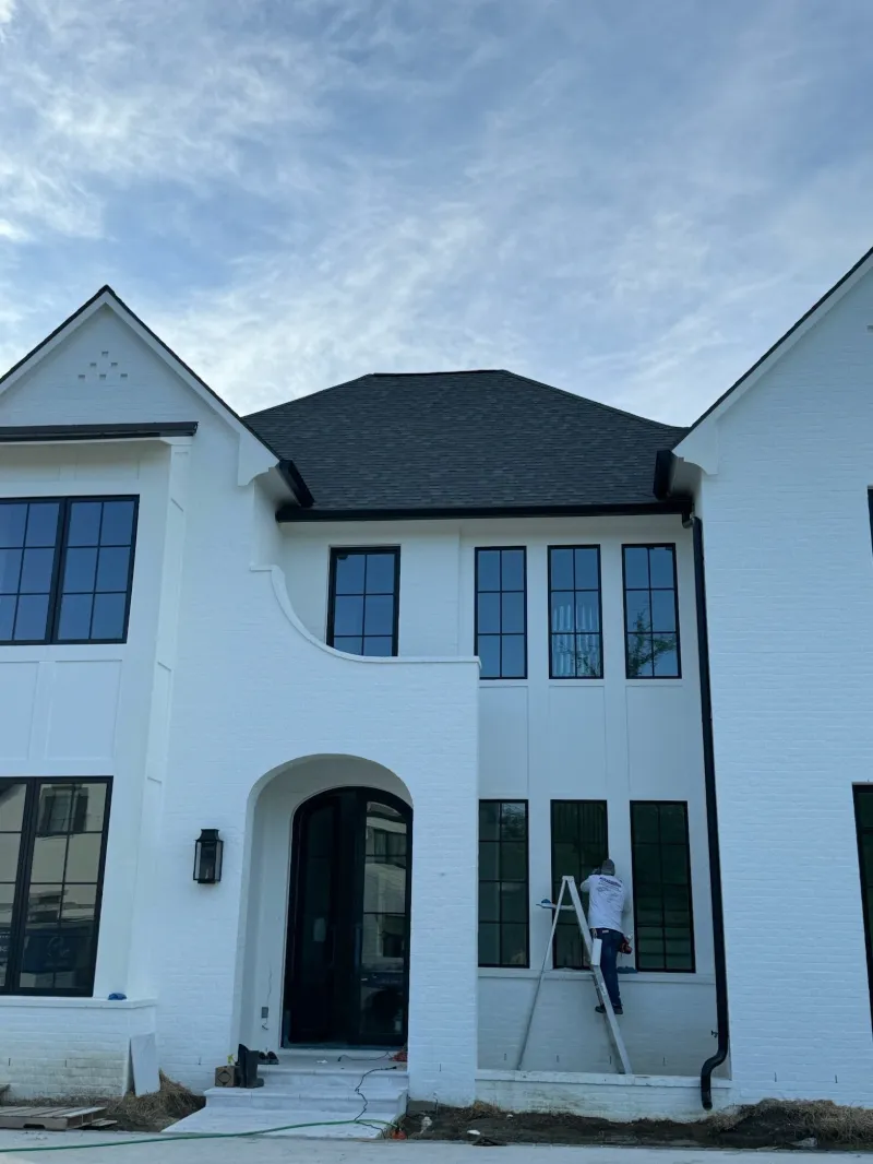 white modern home black gutter detail installation baton rouge performance patios