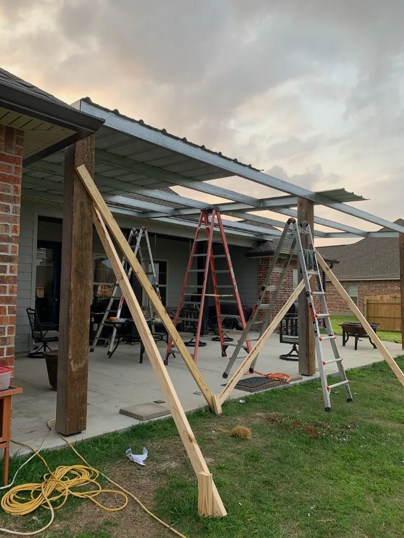 white siding covered patio install baton rouge performance patios and gutters