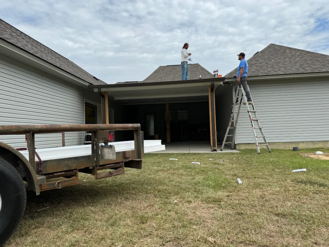 workers installing patio cover house denham springs la