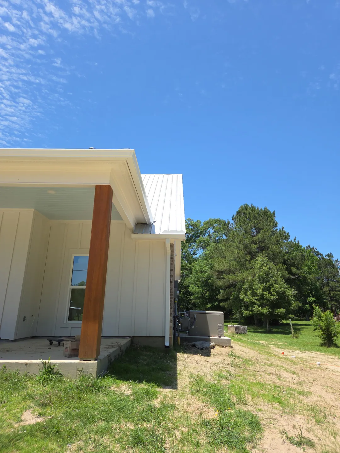 white metal roof corner view seamless gutters performance patios and gutters